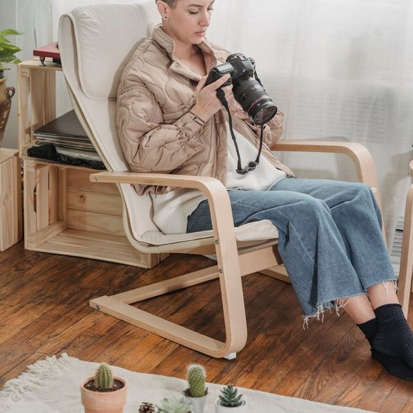 Person relaxing comfortably on a cozy chair after a long day.